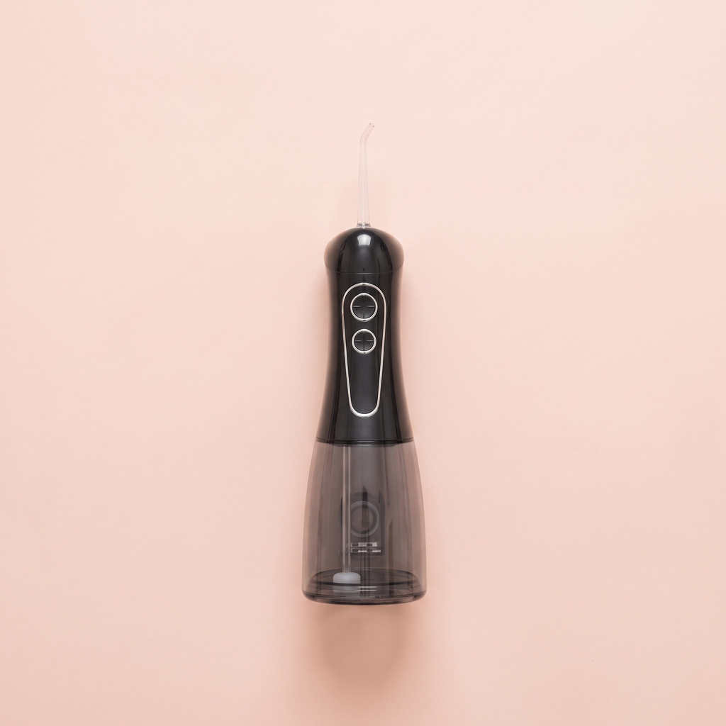 Cordless Dental Water Flosser (300ml) — peach editorial product photo