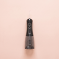 Cordless Dental Water Flosser (300ml) — peach editorial product photo
