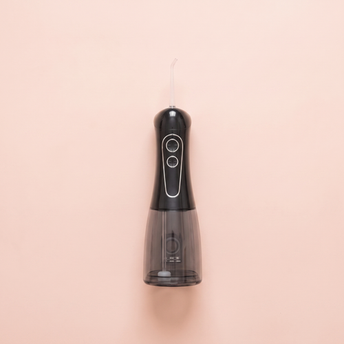 Cordless Dental Water Flosser (300ml) — peach editorial product photo