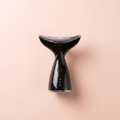 EMS Microcurrent + LED Face & Neck Lifting Device — peach editorial product photo