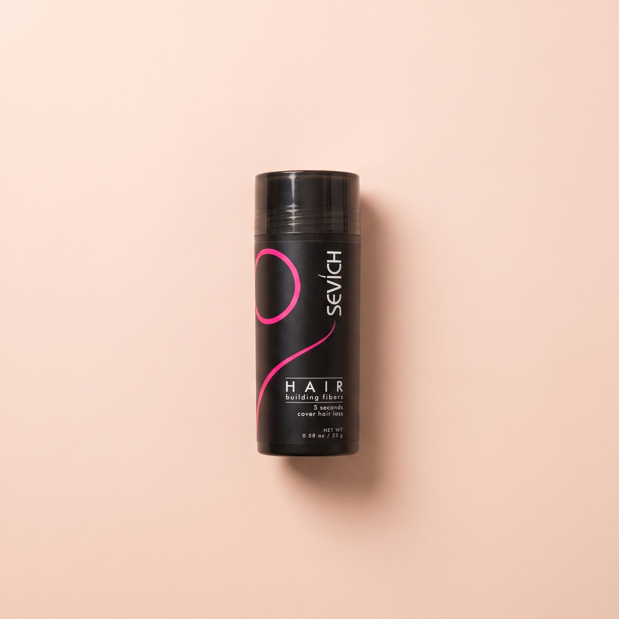 Keratin Hair Building Fibers — peach editorial product photo