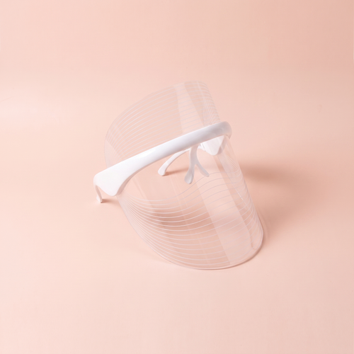 7-Colour LED Red-Light Therapy Face Mask — peach editorial product photo