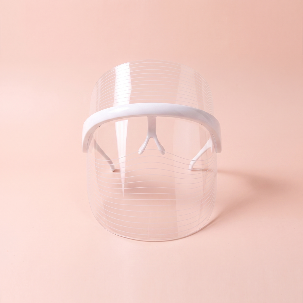 7-Colour LED face mask — front-on view on soft peach background