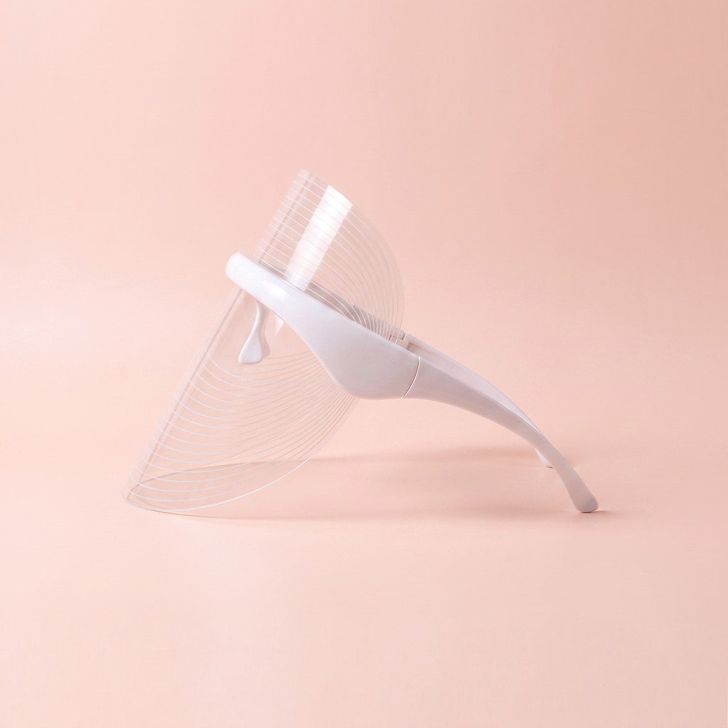 7-Colour LED face mask — side profile view on soft peach background