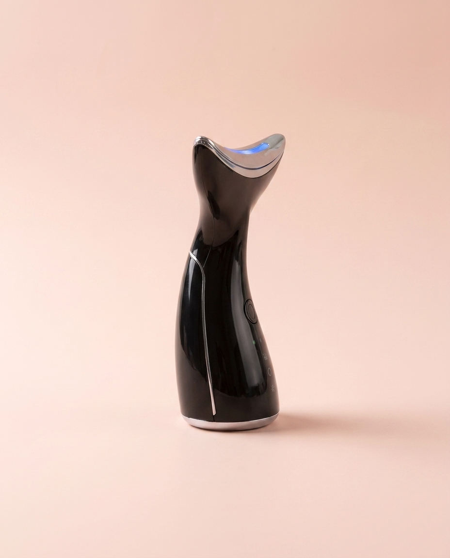 EMS Microcurrent + LED Face & Neck Lifting Device — side profile view on peach background