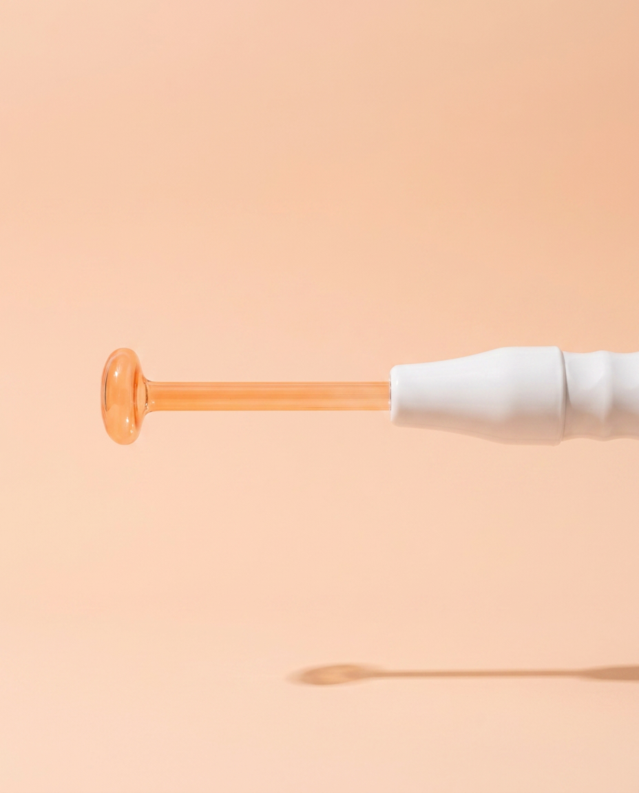 High-Frequency Facial Wand — side profile view on peach background