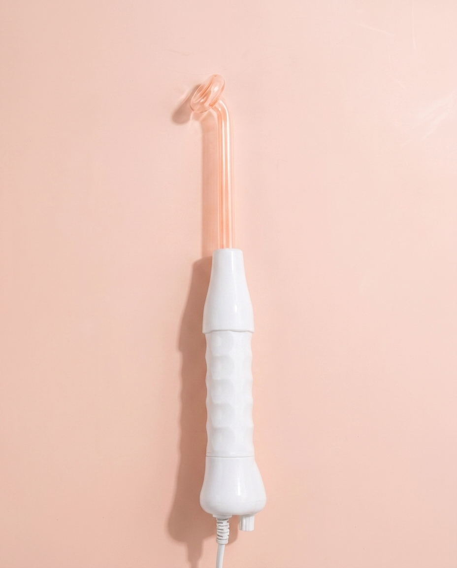 High-Frequency Facial Wand — front three-quarter view on peach background