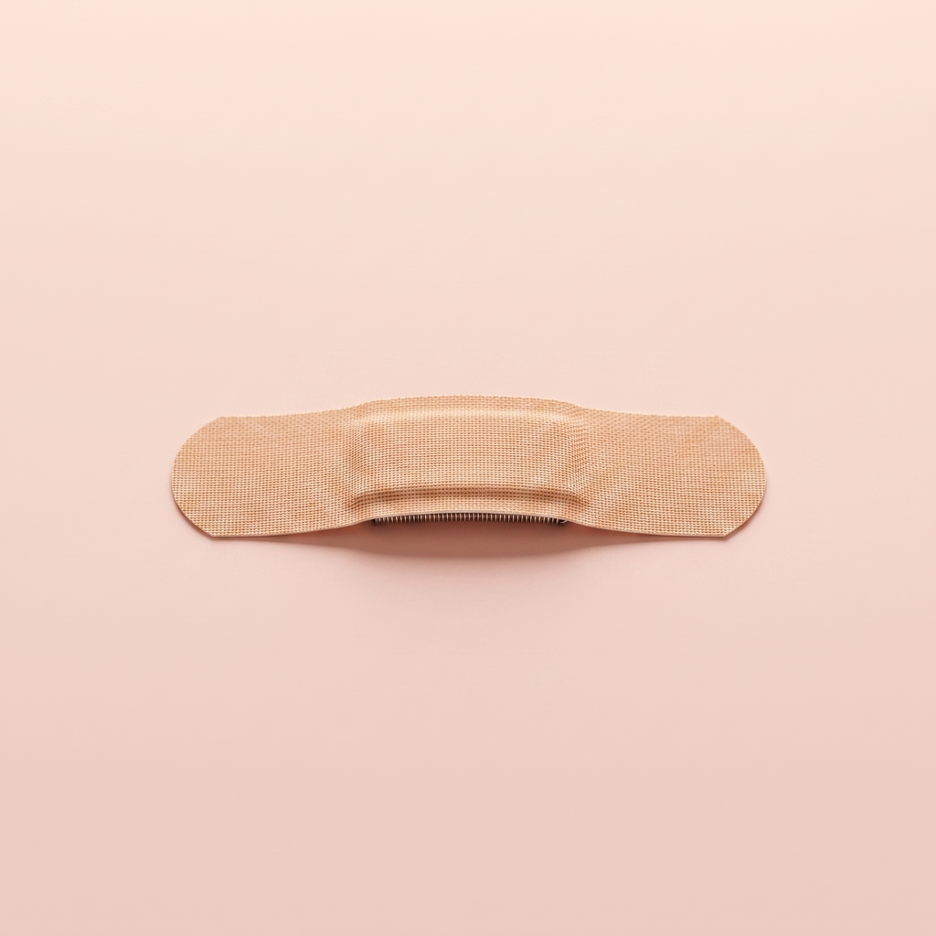 Anti-Snore Nasal Breathing Strips — close-up of a single nasal strip on peach background