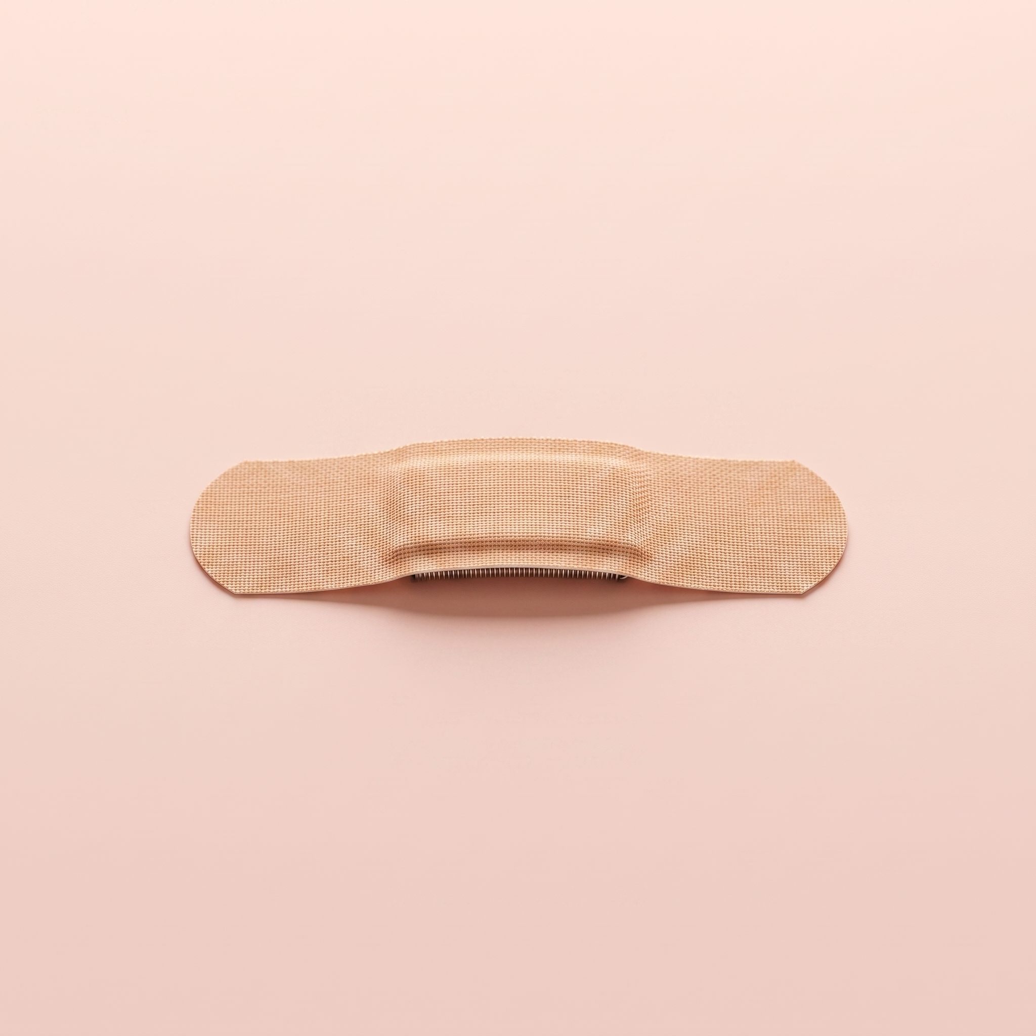 Anti-Snore Nasal Breathing Strips — close-up of a single nasal strip on peach background
