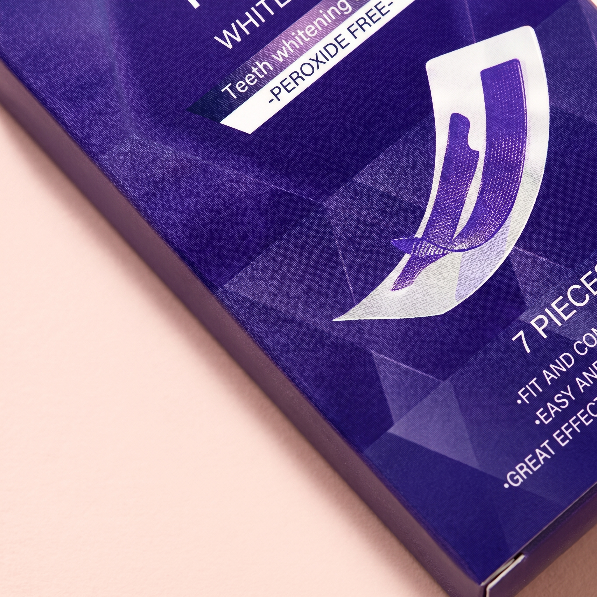 V34 Purple Colour-Correcting Teeth Strips — close-up of the peroxide-free pack detail on peach background