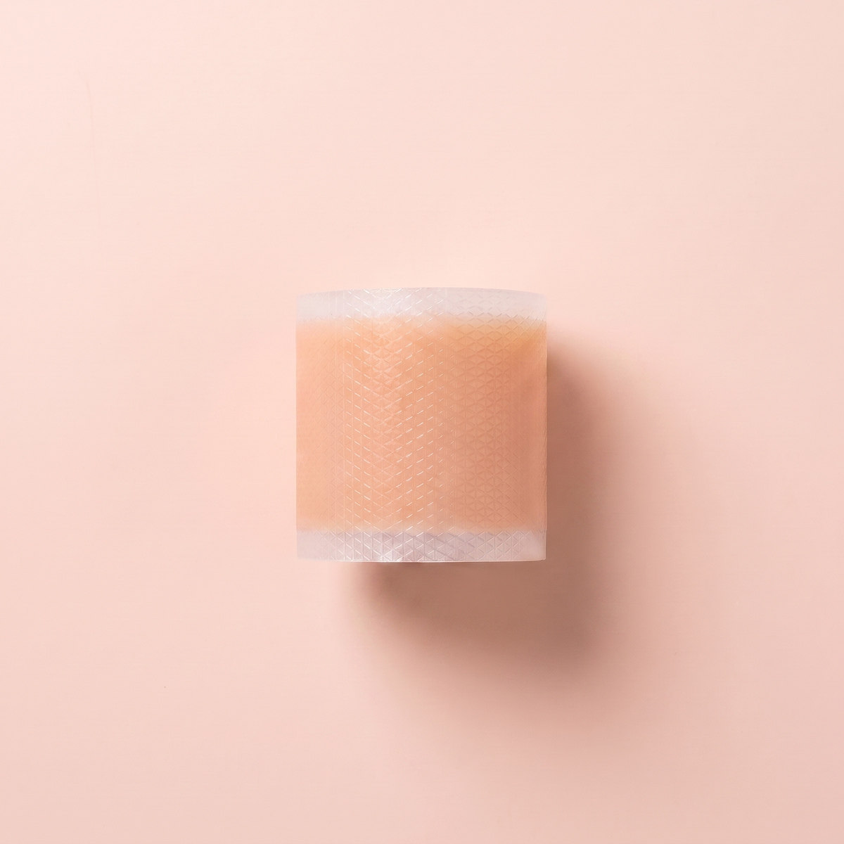 Silicone Scar Sheets — close-up of the silicone gel surface on peach background