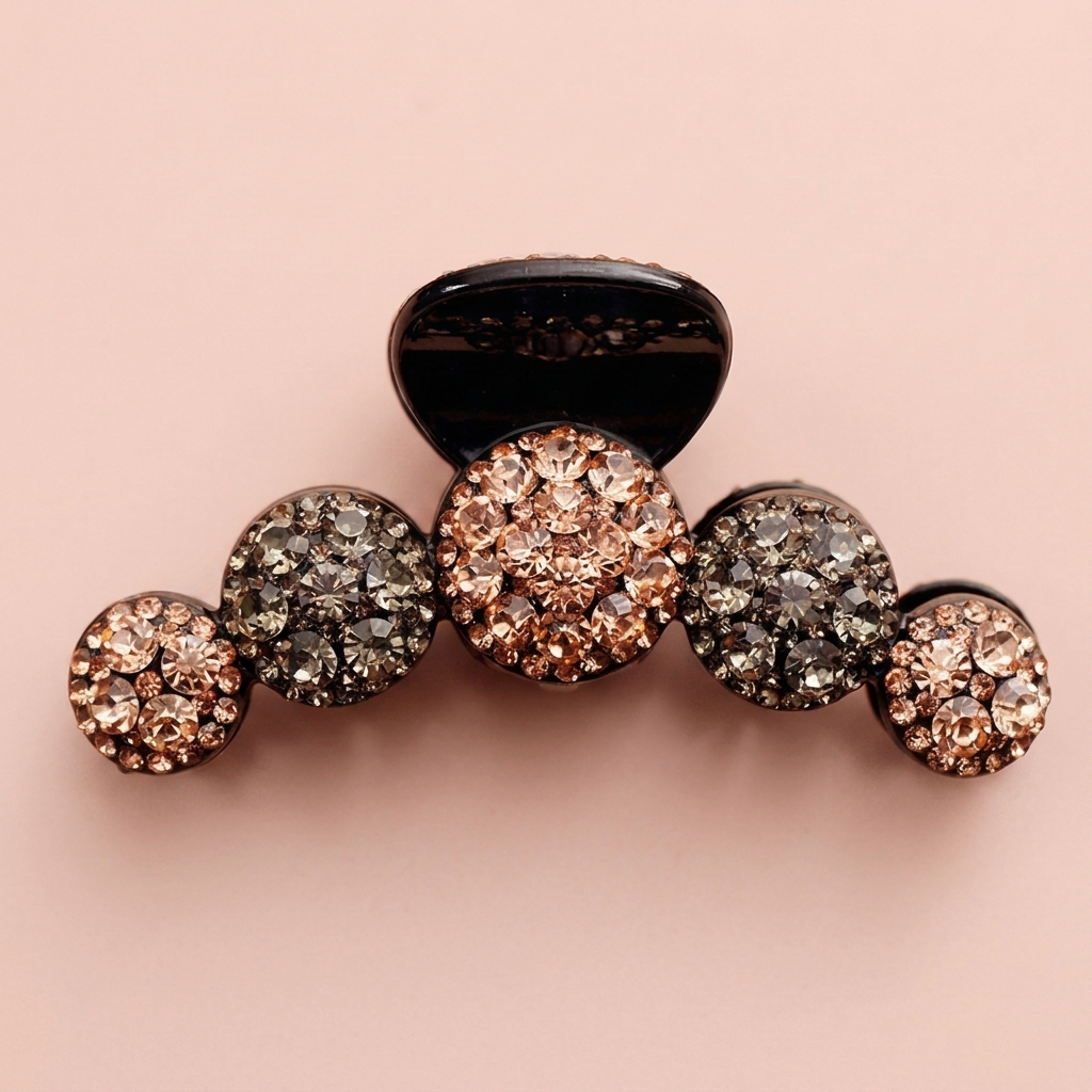 Rhinestone claw hair clip on blush background