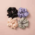 Silk scrunchies on blush background