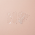 Blackhead nose strips flat-lay on blush background