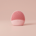 Sonic Silicone Facial Cleansing Brush on blush-pink studio backdrop
