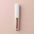 Cordless Ceramic Hair Straightener Brush on blush-pink studio backdrop